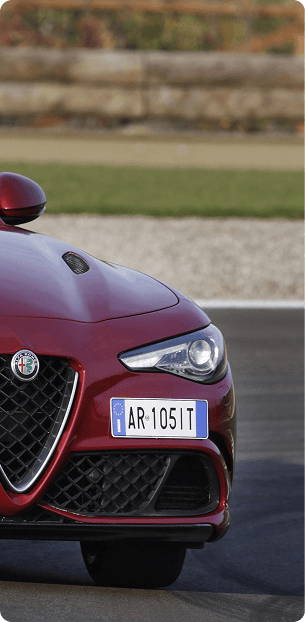 Alfa Romeo Giulia running an Italian AR 105 ST plate